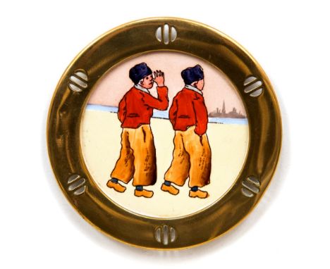 An Arts and Crafts brass and ceramic coaster, circa 1915, in the Secessionist/Jugendstil style, the central plaque painted wi