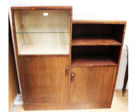 An Art Deco mahogany side cabinet, circa 1935, stepped form, the glazed bookshelf above a cupboard door, beside further shelf