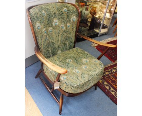 An Ercol Windsor low armchair, circa 1955, stained beech with spindle back