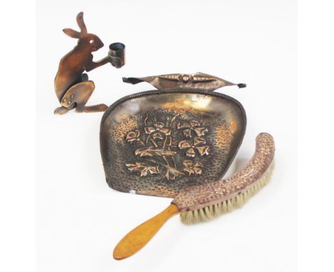 An Art Deco novelty candlestick in the form of a hare, circa 1925, together with an Arts and Crafts repousse copper crumb tra
