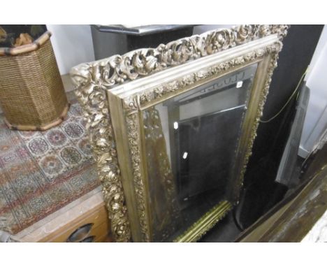 A LARGE GILT FRAMED MIRROR A/F