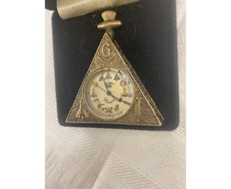 A small triangular Masonic travelling clock- working order