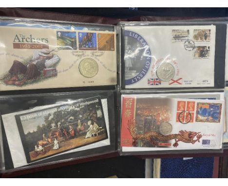An album of first Day Covers and coins