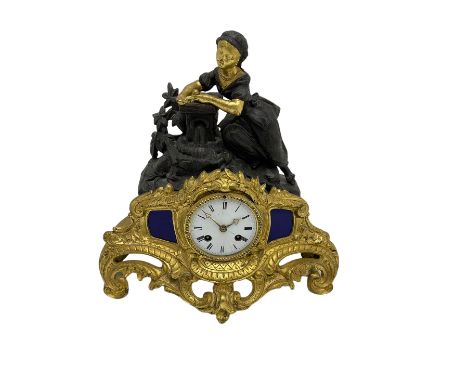 Early 19th century c 1820 French mantle clock in a spelter and gilt case, eight day striking movement with a silk suspension,