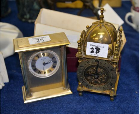 A gilt-metal timepiece in the form of a lantern clock by Smiths Clocks and Watches Ltd. with original box and another timepie