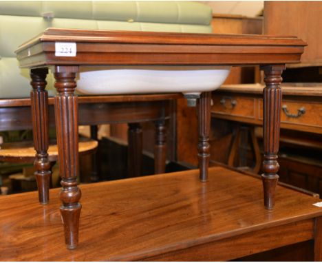 A George IV mahogany bidet and cover, in the manner of Gillows, the ceramic basin impressed 'WEDGWOOD', on turned reeded legs