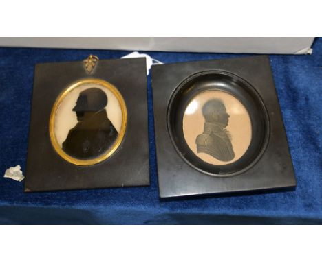 A portrait silhouette of a Clergyman, and an engraving of an officer, each in an ebonised frame 