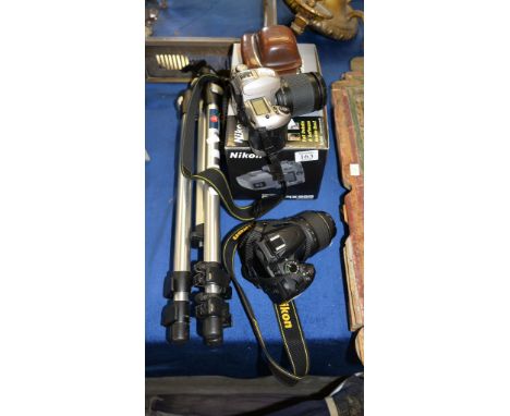 A Nikon D3200 camera, a Nikon F80 camera a Nikon CoolPix995 (boxed) a Kodak camera, and a Manfrotto tripod 