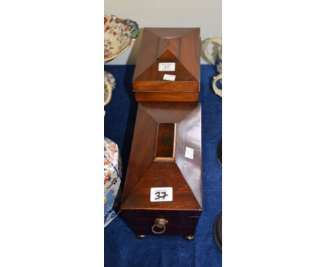 Ω A mahogany sarcophagus shaped tea caddy, circa 1820, with hinged cover, 28cm wide; and a mahogany tea caddy refitted as a w