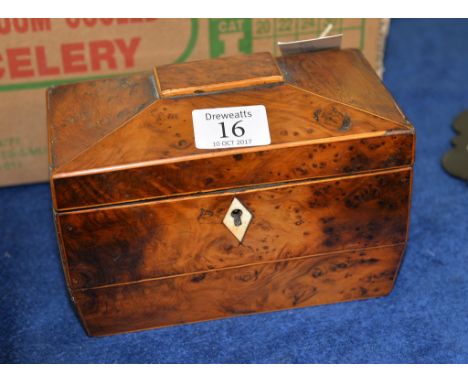 A Regency burr yew tea caddy, circa 1815, of sarcophagus form with two interior compartments, 14cm high, 19cm wide, 11cm deep