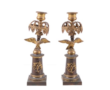 A pair of Regency or George IV gilt and patinated metal lustre candlesticks,  circa 1820, the engine milled sockets above arc