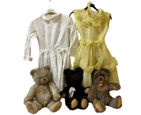 A childhood collection of dresses and toys to include a vintage Steiff Zotty teddy bear&nbsp; with moving joints and growler.