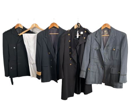 Vintage men's uniforms to include a Fireman's jacket, a British Airways pilot's jacket, a Burberry's label officers RAF jacke