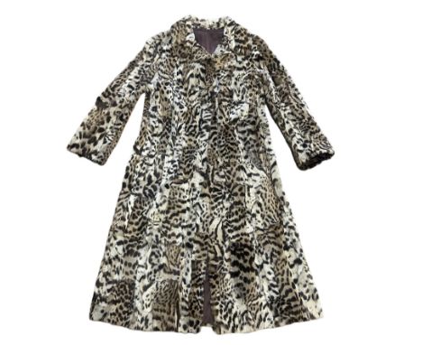 Vintage pieced ocelot fur coat with concealed furrier hook fastening and embroidered MT to inner pocket. Strong, satin lining