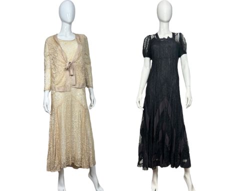 A cream lace 1930s evening or wedding dress with matching jerkin, a 1930s black lace evening gown with short balloon sleeves 