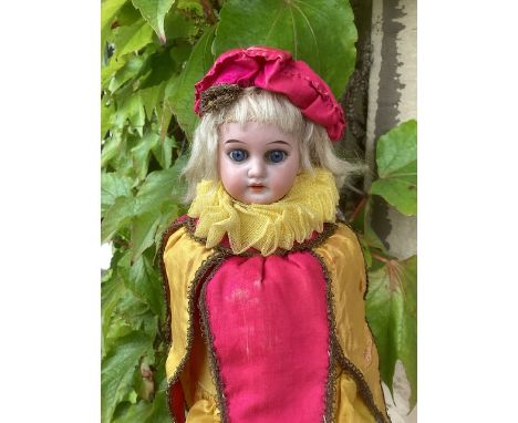 German bisque head Marotte working musical doll on wooden pole; All original arrive in gold and Magenta with tailed tunic and