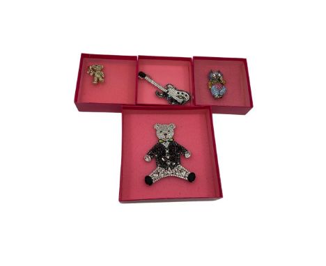 Butler &amp; Wilson brooches to include an extra-large statement teddy bear brooch wearing a tux formed of crystals, a multi-