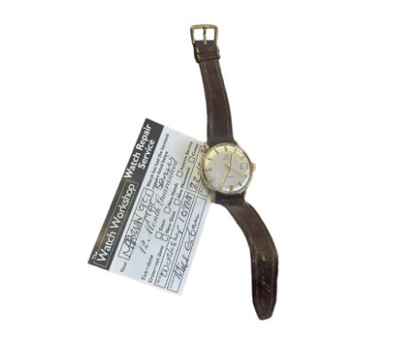 A c1960s Marvin automatic watch in unmarked 9ct gold casing with brown leather strap. last serviced 22-10-13 and appears to b
