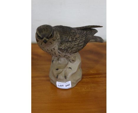 A painted cast Poole pottery model of Merlin 
