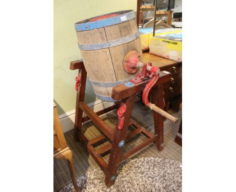 A Listers coopered barrel churn with manual crank handle,supported on a pitch pine stand 