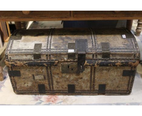 A 19th-century brass bound and studded hide covered dome top trunk, 43cm x 92cm 
