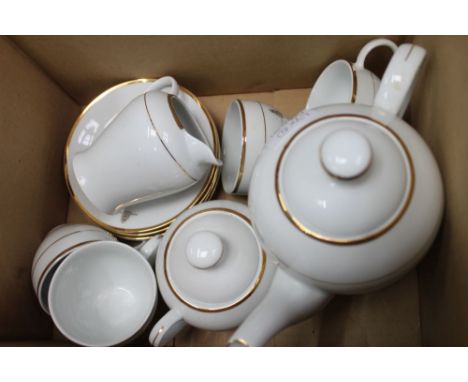 A porcelain part tea service plain white glazed with gold band produced to celebrate the Queen's Golden Jubilee 2002 