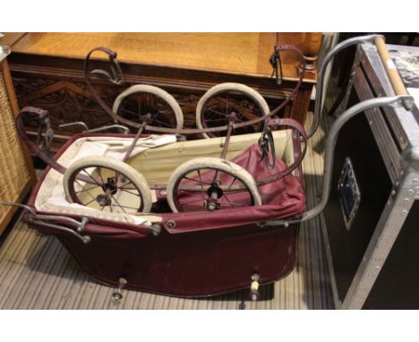 A vintage child's Preambulator belay top finished in burgundy 