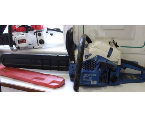 A Hyundai 2 1/2 k watt petrol driven chainsaw 