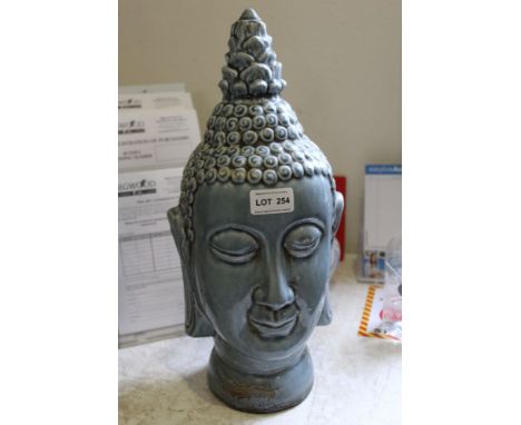 A light blue glazed pottery Buddha head 