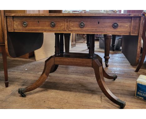 A late Victorian light mahogany sofa table on a decorative four legged base with boxwood stringing and two drawers. 72cm x 97