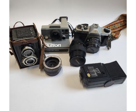 A collection of photographic ware: a Pentax SLR camera, A Nishika flash gun,a Chinon lens and a Prinzflex 3x converter, a Box