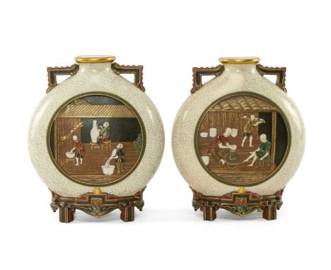 RARE PAIR ROYAL WORCESTER 'JAPONISME' MOON FLASKS, dated 1874, in the Aesthetic taste with angular handles and moulded bracke