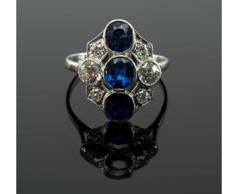 WHITE METAL SAPPHIRE & DIAMOND CLUSTER RING, the three vertical sapphires complimented by six old cut diamonds, ring size L 1