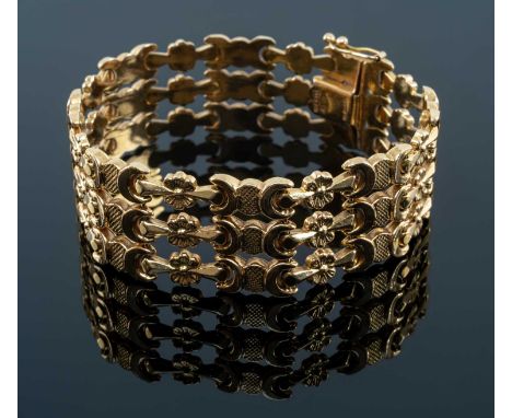 18CT GOLD TRIPLE ROW WIDE BRACELET, flower head and crescent link, integrated box link clasp, 19cms long, stamped '750', 29.1