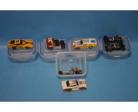 FOUR VINTAGE TCR ITEMS to include three slot cars and one articulated lorry cab, cars from 1978, 1980, 1980 lorry cab togethe