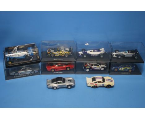 EIGHT BOXED SCALEXTRIC CARS to include Elf Tyrrell, Jaguar XJ220, Mercedes Benz CLKLM, Subaru WRC, Porsche, etc. Please note 