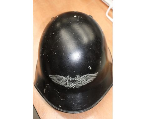 World War II Swiss steel combat helmet with German reproduction Luftschutz insignia