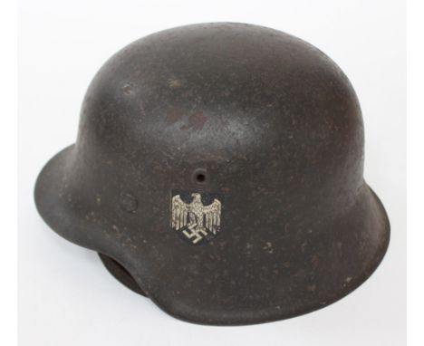 German Heer M42 helemt; British MKII steel helmet with net, cloth insignia and badges - belts 