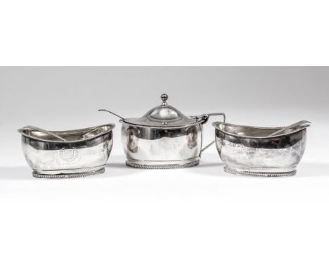 A George III silver "West Kent Mess" oval three piece condiment set with gadroon mounts, comprising - mustard pot with domed 