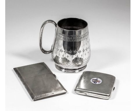 A Victorian silver tankard of tapered form engraved with bands of geometric ornament, with C-scroll handle and on moulded foo