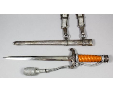 A German World War II Luftwaffe (2nd model) dress dagger, the 10ins double edged bright steel blade etched with maker's mark,