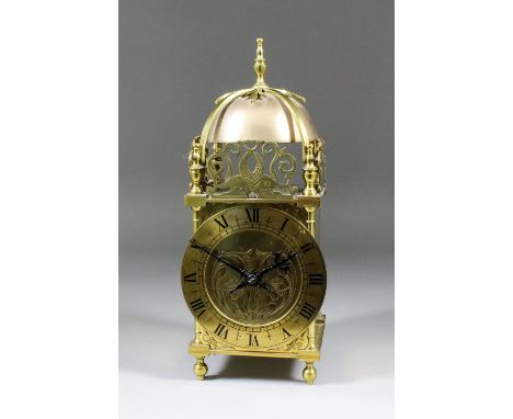 A brass cased lantern clock of 17th Century design, the 4.75ins diameter brass chapter ring with Roman numerals, to the Frenc