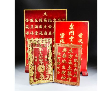 A Chinese carved red painted and giltwood rectangular tablet inscribed with characters, 14.365ins (36.5cm) x 9.5ins (24.2cm),