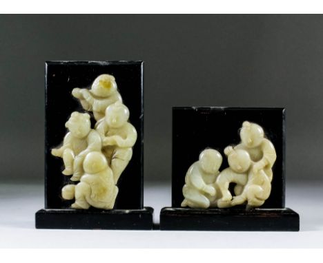 A Chinese jade relief carving of a group of four children, 4.625ins (11.7cm) high, and a similar of three children, 3.125ins 