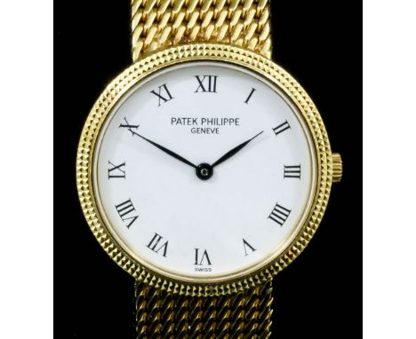 A 1990's lady's Patek Philippe 18K gold cased wristwatch, the circular white dial with Roman numerals, contained in plain 23m