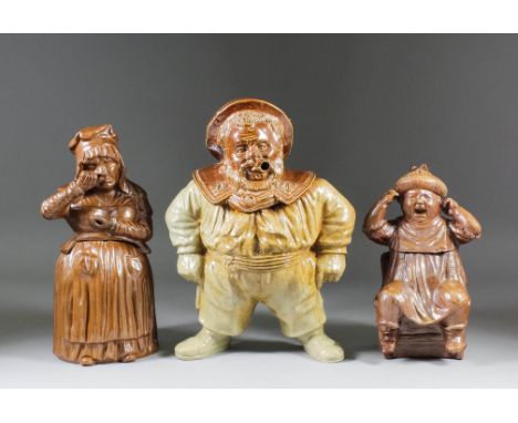 A 19th Century salt glazed stoneware box and cover moulded in the form of "Jack Tar", the pot-bellied figure with hands to hi