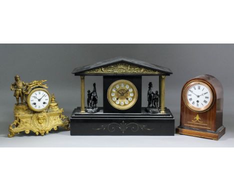 A late 19th Century French black slate mantel clock, the 4ins diameter gilt dial with circular Arabic numeral cartouches, to 