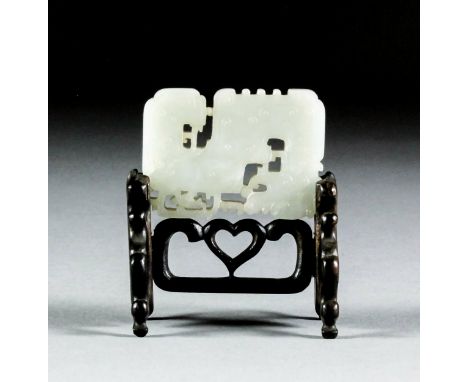 A Chinese white jade rectangular plaque, pierced and carved with an archaistic dragon, 2.5ins (6cm) x 1.75ins (4.5cm) (Qing D