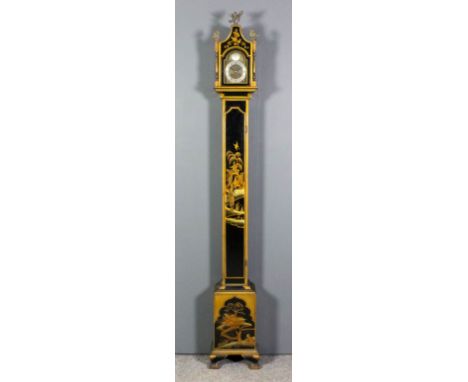 A 20th Century black japanned "grandmother" clock, the 4.75ins arched brass dial with silver chapter ring with Roman and Arab