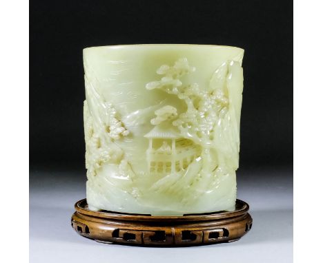 A Chinese celadon jade cylindrical brush pot carved in relief with mountain river landscape, with a figure in a pagoda, a fig